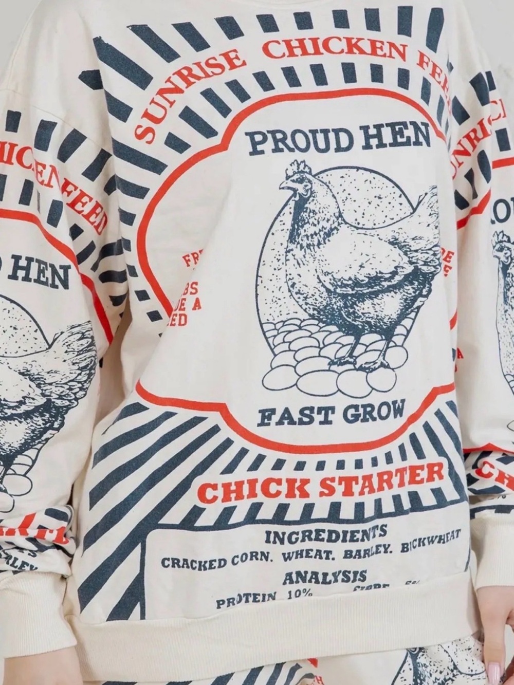 The Sak Cream Sweatshirt with Navy and Red Chicken Graphic
